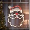 17" Lighted Santa Face Christmas Silhouette Window Decoration 2 17" Lighted Santa Face Christmas Silhouette Window Decoration -Outdoor Garden Living 95013 LTD STD ORN SANTA FACE IN USE